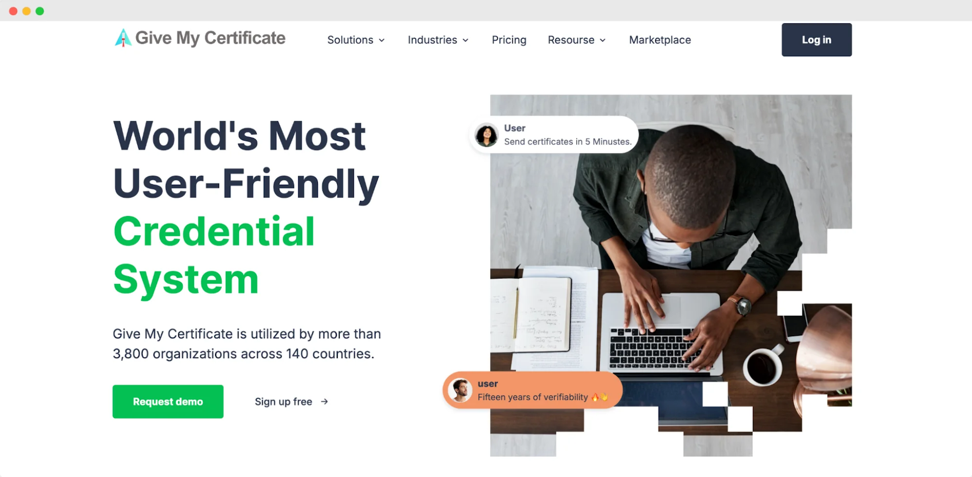 Give My Certificate's website featuring a person working on a laptop